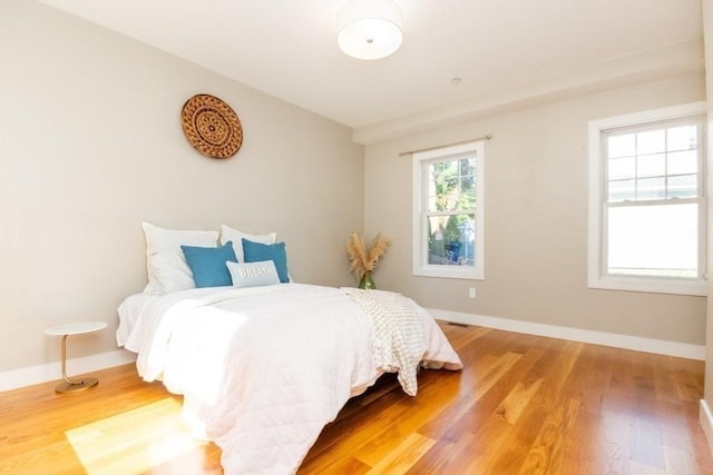 bedroom with wood-type flooring