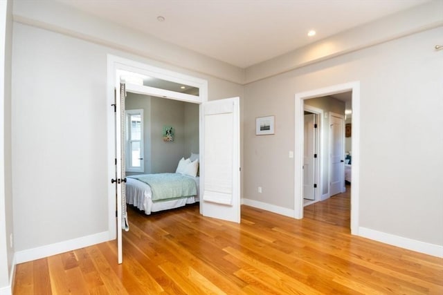 unfurnished bedroom featuring wood-type flooring