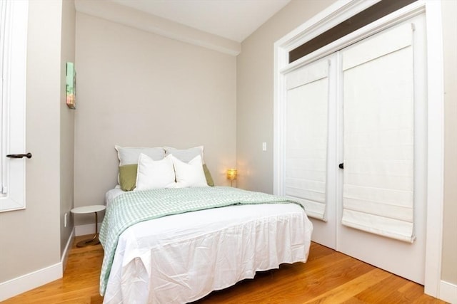 bedroom with hardwood / wood-style floors