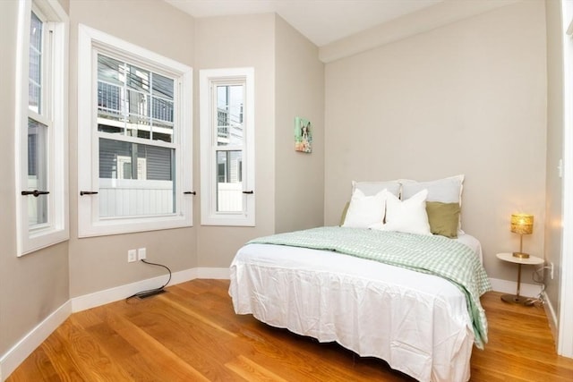 bedroom with hardwood / wood-style floors