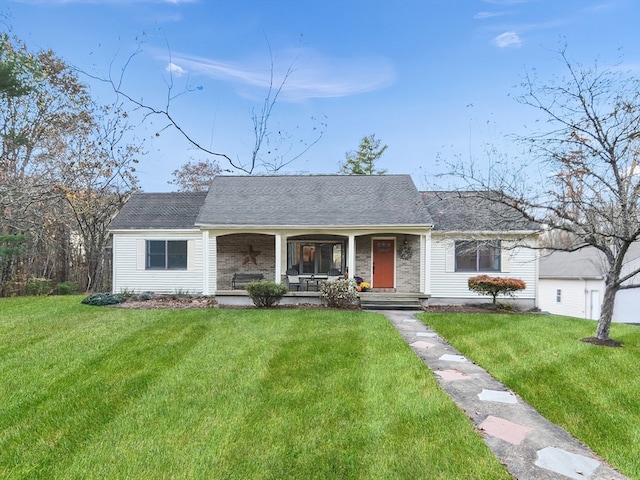 ranch-style house with a porch and a front lawn