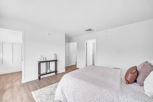 bedroom with light hardwood / wood-style flooring