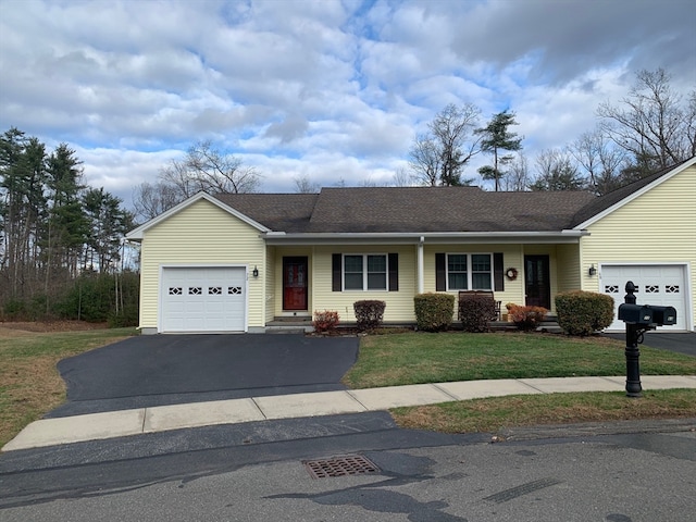 single story home featuring a garage and a front yard