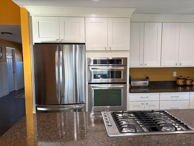 14 Cavite St, Devens, MA 01434 - kitchen featuring stainless steel appliances, white cabinets, and dark stone counters