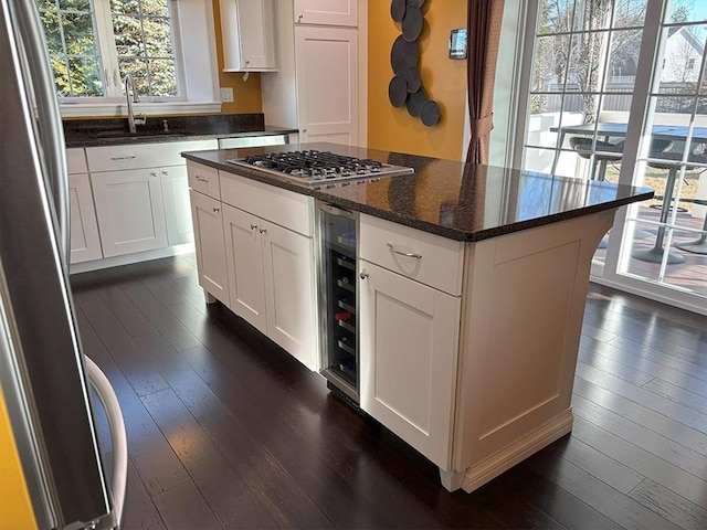 14 Cavite St, Devens, MA 01434 - kitchen with dark wood-style flooring, appliances with stainless steel finishes, a sink, and white cabinets