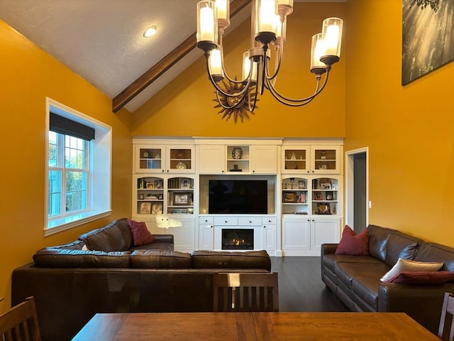14 Cavite St, Devens, MA 01434 - living area featuring a chandelier, high vaulted ceiling, dark wood-style flooring, beam ceiling, and a warm lit fireplace
