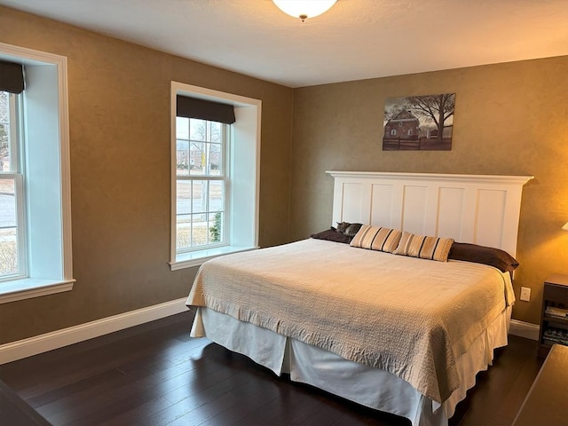 14 Cavite St, Devens, MA 01434 - bedroom with dark wood-style flooring and baseboards