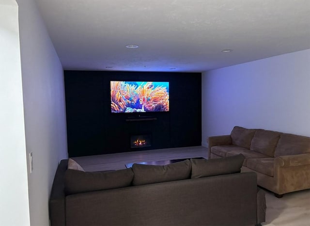 14 Cavite St, Devens, MA 01434 - cinema room featuring a lit fireplace and recessed lighting