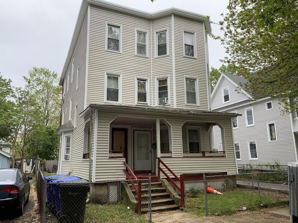 81-83 Beaumont St, Springfield, MA 01108 - view of property featuring a fenced front yard, a porch, and cooling unit