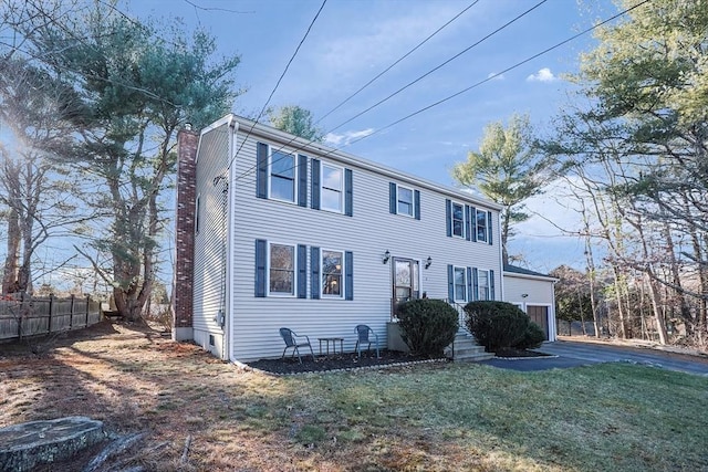 colonial home with a front yard