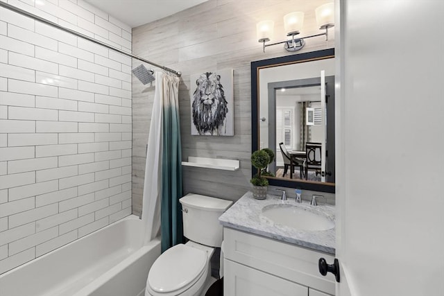 full bathroom with toilet, vanity, and shower / bath combo with shower curtain