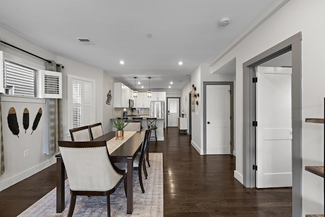dining area with recessed lighting, baseboards, and dark wood-style floors