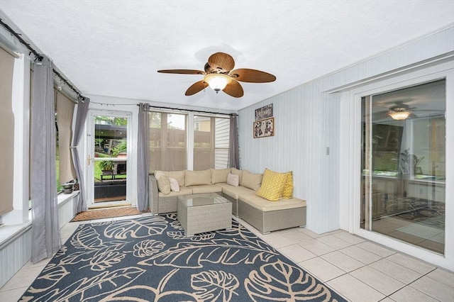 11 Florence Rd, Lowell, MA 01851 - living room with light tile patterned floors and a ceiling fan