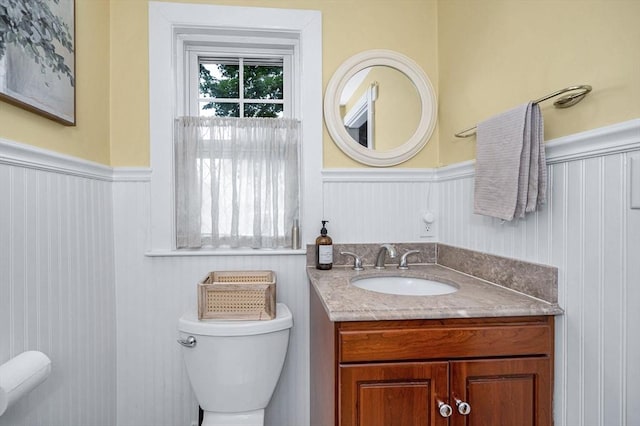 11 Florence Rd, Lowell, MA 01851 - bathroom featuring toilet, wainscoting, and vanity