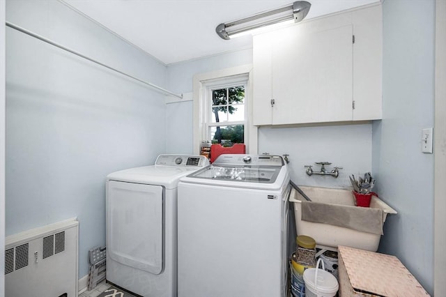 11 Florence Rd, Lowell, MA 01851 - laundry room featuring cabinet space, separate washer and dryer, and radiator heating unit
