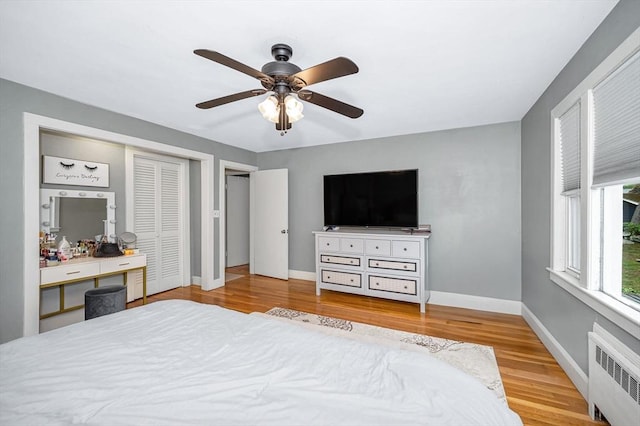 11 Florence Rd, Lowell, MA 01851 - bedroom with radiator, wood finished floors, baseboards, and ceiling fan