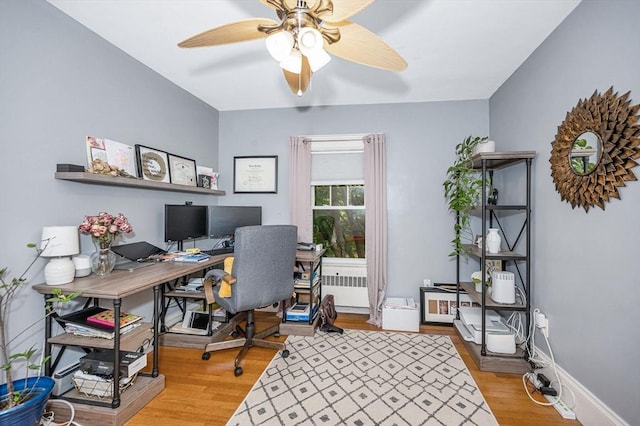 11 Florence Rd, Lowell, MA 01851 - home office featuring radiator, a ceiling fan, wood finished floors, and baseboards