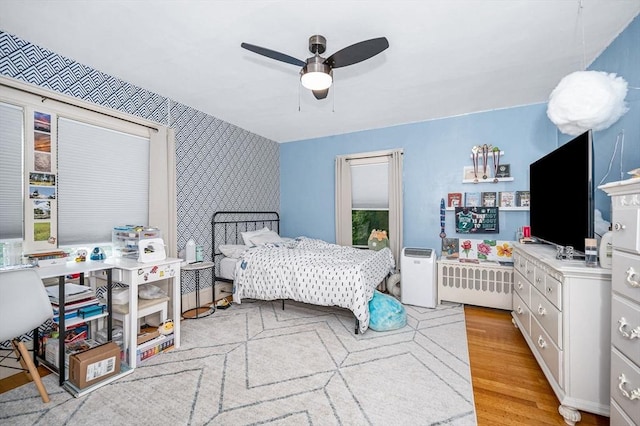 11 Florence Rd, Lowell, MA 01851 - bedroom with light wood-style floors, wallpapered walls, and a ceiling fan