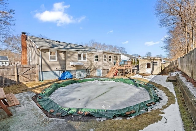 view of basketball court featuring stairs and a fenced backyard