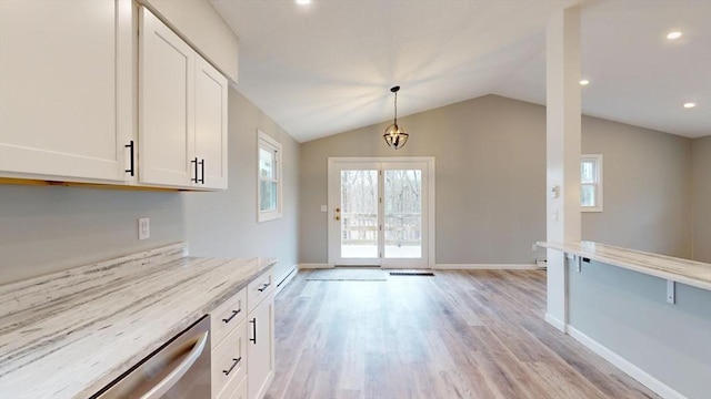 kitchen featuring dishwasher, a wealth of natural light, pendant lighting, and white cabinets