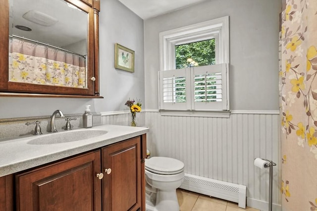 8 Messina Cir, Methuen, MA 01844 - bathroom featuring a baseboard radiator, vanity, tile patterned flooring, and a wainscoted wall