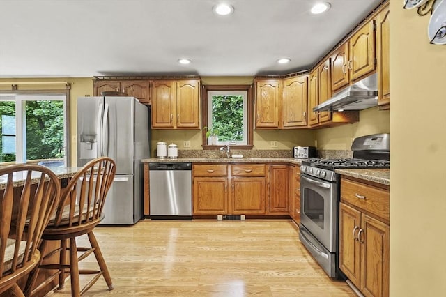 8 Messina Cir, Methuen, MA 01844 - kitchen with appliances with stainless steel finishes, under cabinet range hood, healthy amount of natural light, light wood-style floors, and recessed lighting