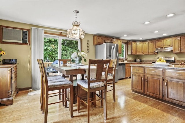 8 Messina Cir, Methuen, MA 01844 - kitchen featuring under cabinet range hood, stove, light wood finished floors, brown cabinetry, and recessed lighting