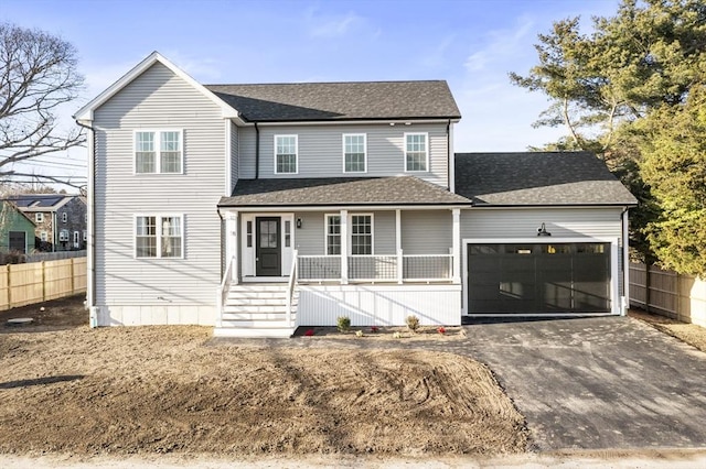 view of front facade with a porch and a garage