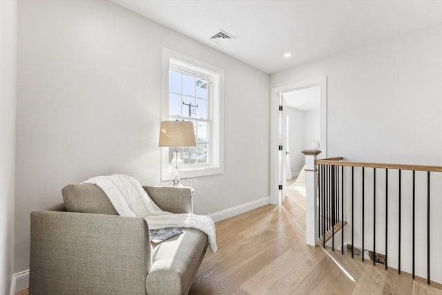 sitting room featuring light hardwood / wood-style floors