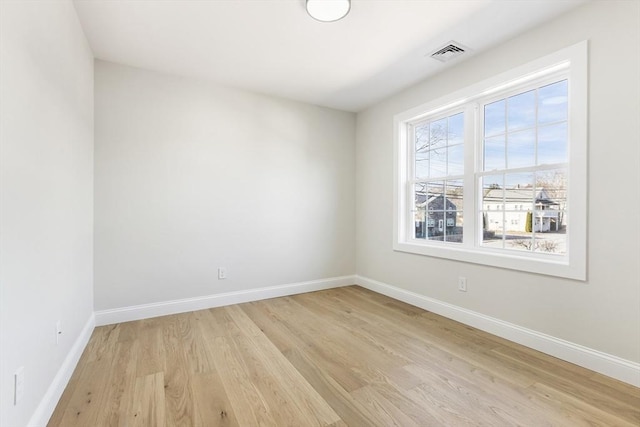 spare room featuring light hardwood / wood-style floors