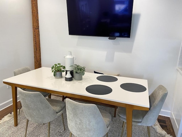 dining area featuring wood-type flooring