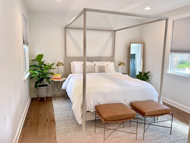 bedroom with hardwood / wood-style floors