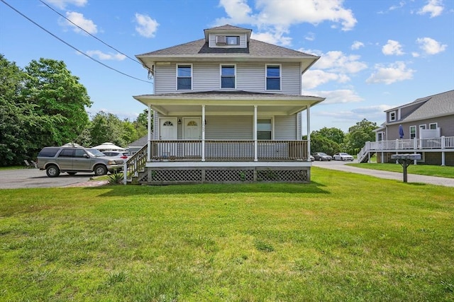 view of front of home with a front lawn and covered porch