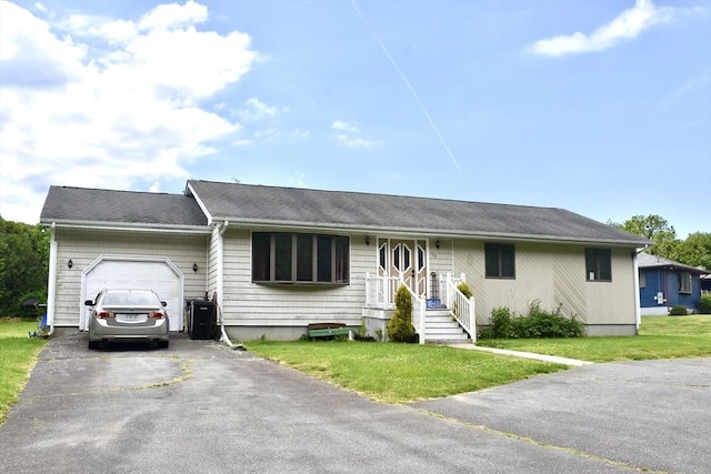 110 Lucy Little Rd, Dartmouth, MA 02747 - single story home featuring an attached garage, driveway, and a front lawn