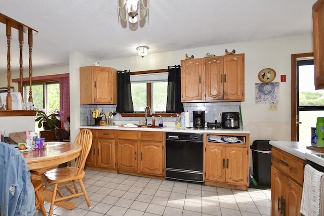 110 Lucy Little Rd, Dartmouth, MA 02747 - kitchen with dishwasher, light countertops, and decorative backsplash