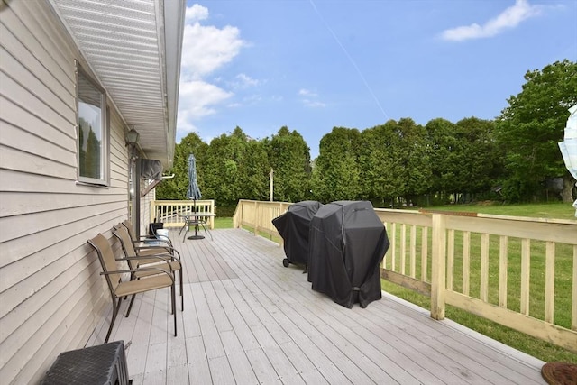 110 Lucy Little Rd, Dartmouth, MA 02747 - deck with area for grilling, a lawn, and view of scattered trees