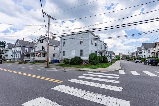 132 Myrtle St Unit 1, Waltham, MA 02453 - view of asphalt road featuring a residential view, sidewalks, and curbs