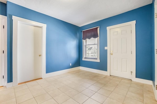 132 Myrtle St Unit 1, Waltham, MA 02453 - foyer with baseboards and light tile patterned flooring