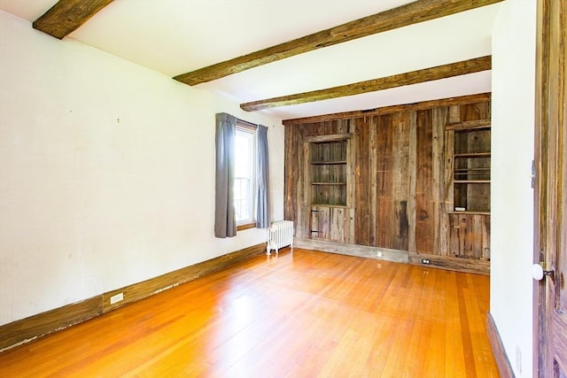 67 E Main St, West Brookfield, MA 01585 - spare room with radiator heating unit, beamed ceiling, and wood finished floors