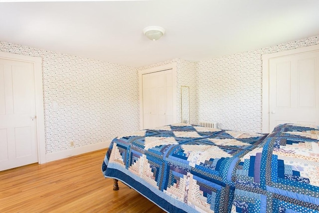 67 E Main St, West Brookfield, MA 01585 - bedroom with wallpapered walls, wood finished floors, and baseboards