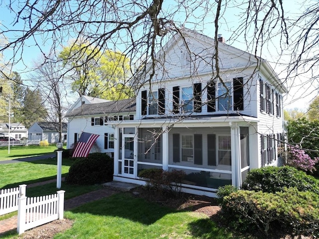 67 E Main St, West Brookfield, MA 01585 - rear view of property with a sunroom and a chimney
