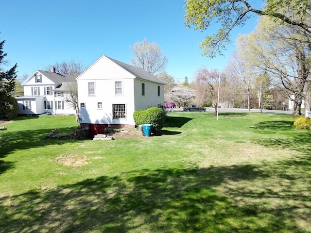 67 E Main St, West Brookfield, MA 01585 - rear view of house featuring a yard
