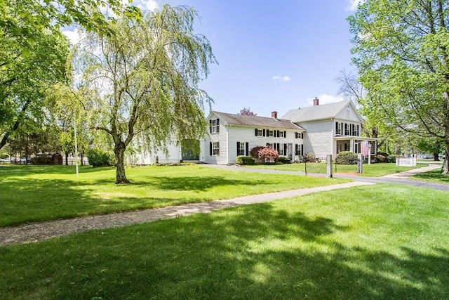 67 E Main St, West Brookfield, MA 01585 - view of front of home with a front lawn and a chimney