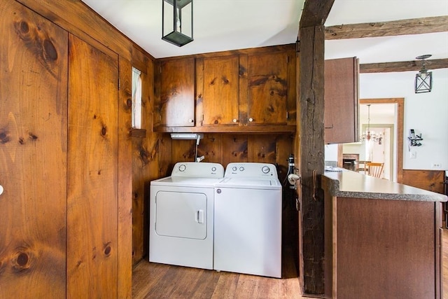67 E Main St, West Brookfield, MA 01585 - laundry room featuring cabinet space, washer and dryer, dark wood-type flooring, and wood walls