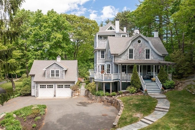 view of front of house featuring a garage and covered porch