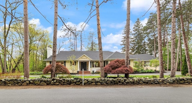 ranch-style house with a chimney
