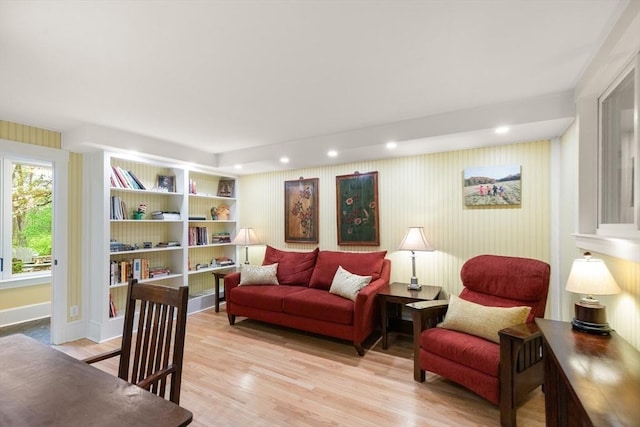 sitting room with light wood-style flooring, recessed lighting, and baseboards