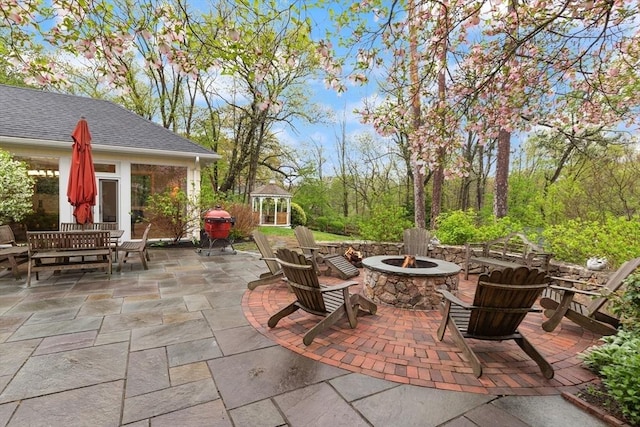 view of patio / terrace with a gazebo and an outdoor fire pit
