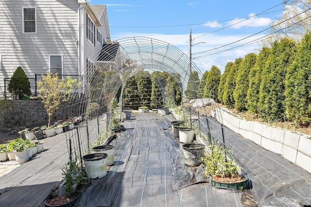 view of home's community with fence