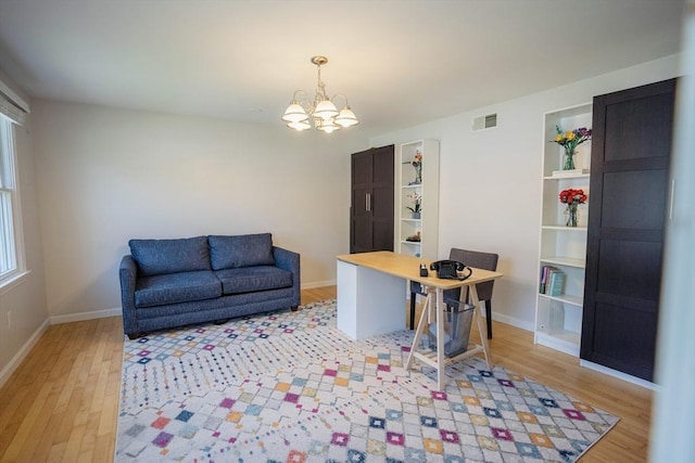575 E St, Mansfield, MA 02048 - office space with light wood finished floors and a chandelier